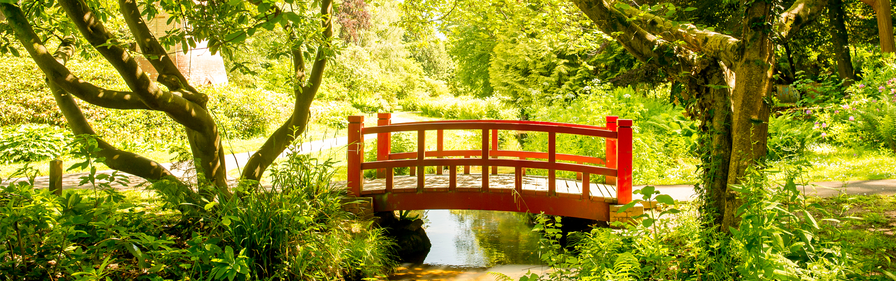 Tranquil red bridge found in Bournemouth Lower Gardens 